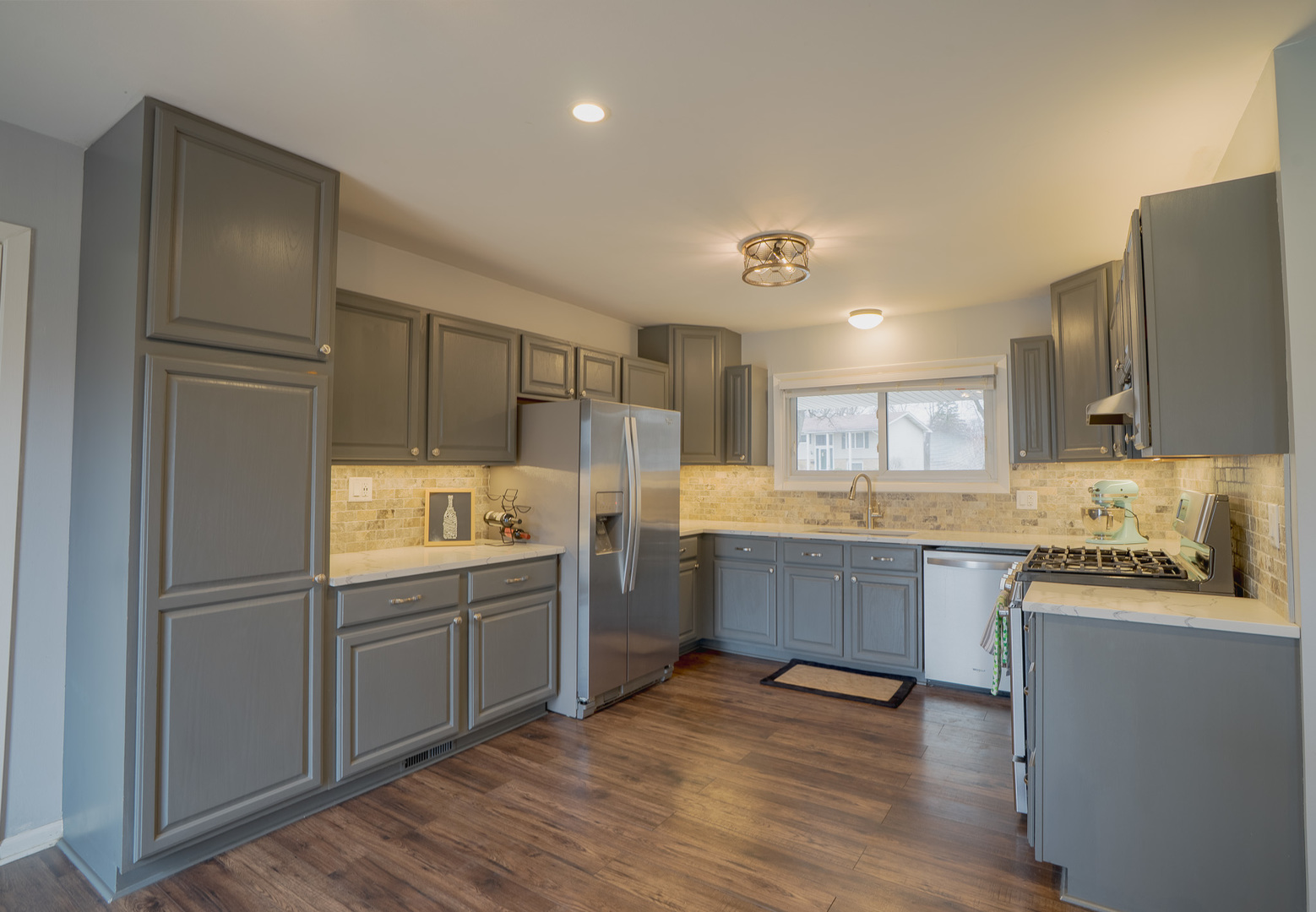 1935 Larchmont Road Hoffman Estates, IL 60169 - Photo 10 of 30 a kitchen with counter top space and stainless steel appliances
