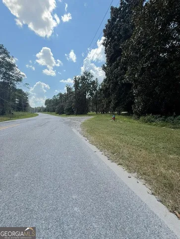 a view of a field with an trees