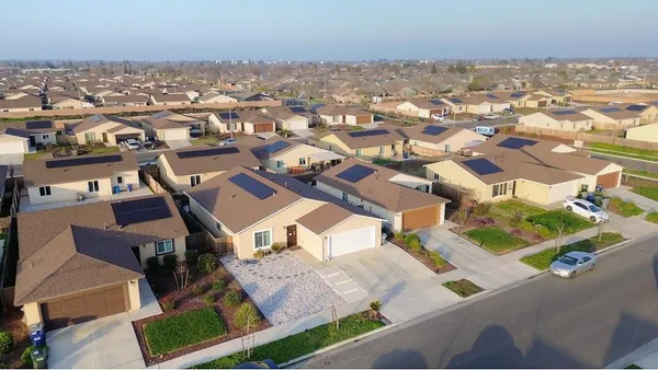 an aerial view of a house with a swimming pool