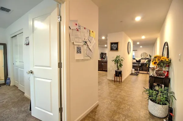 a view of a living room and entryway