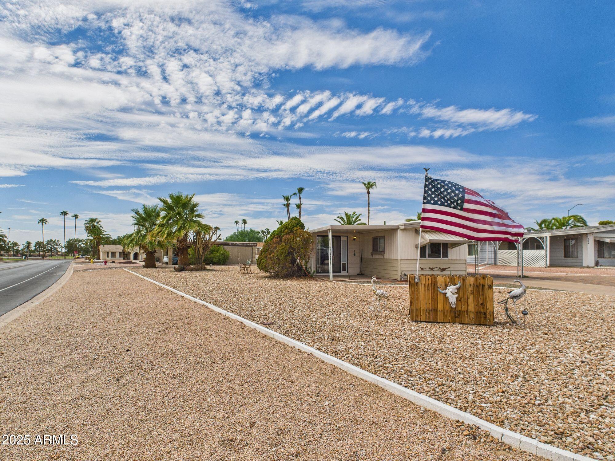 428 South 80th Way Mesa, AZ 85208 - Photo 2 of 21 a street view with tall buildings