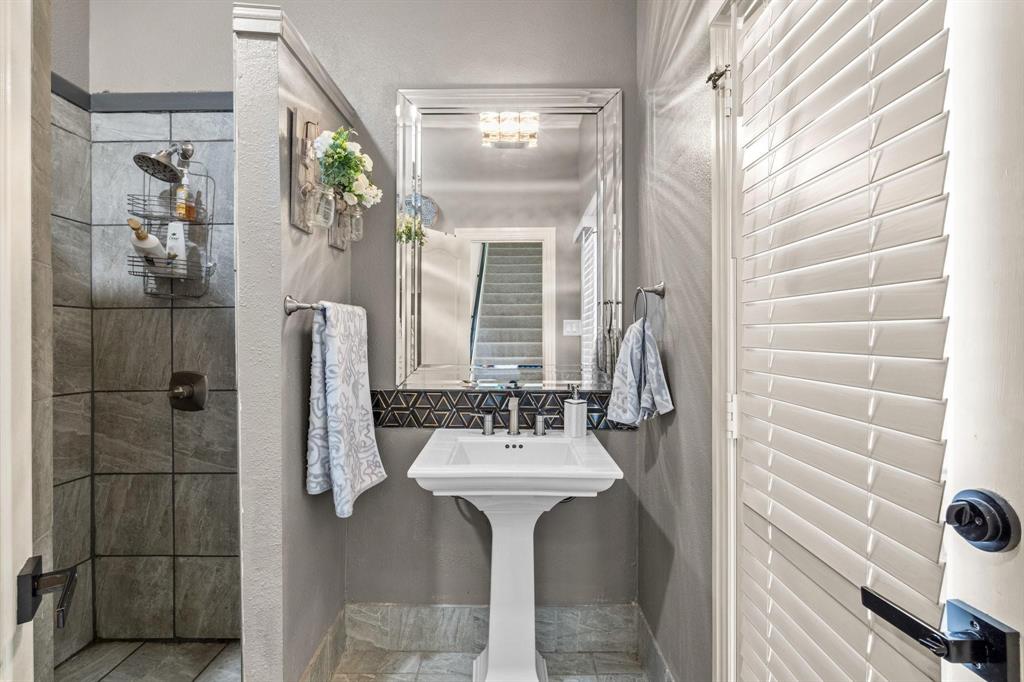 200 Mill Crossing West Colleyville, TX 76034 - Photo 18 of 40 a bathroom with a sink and a mirror