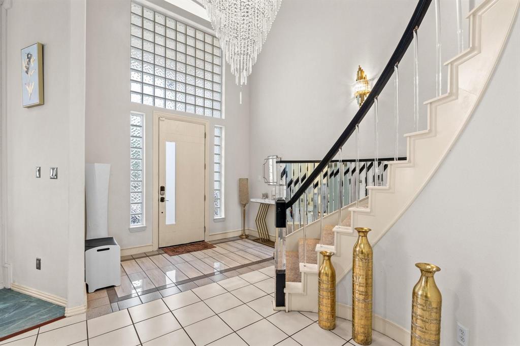 200 Mill Crossing West Colleyville, TX 76034 - Photo 2 of 40 a view of entryway with wooden floor and stairs