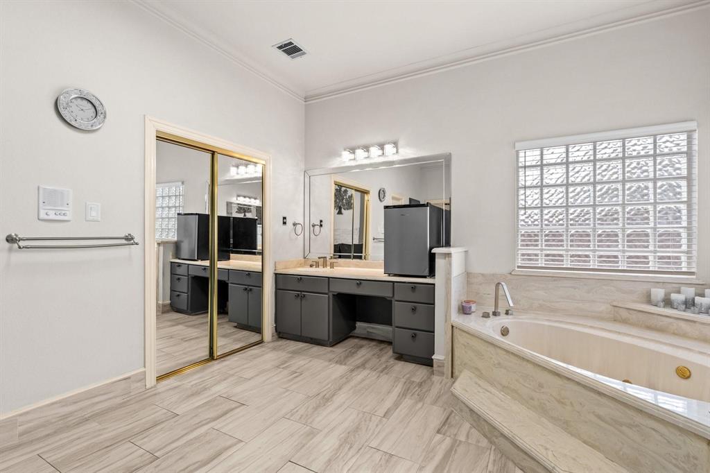 200 Mill Crossing West Colleyville, TX 76034 - Photo 23 of 40 a large bathroom with a large tub and sink