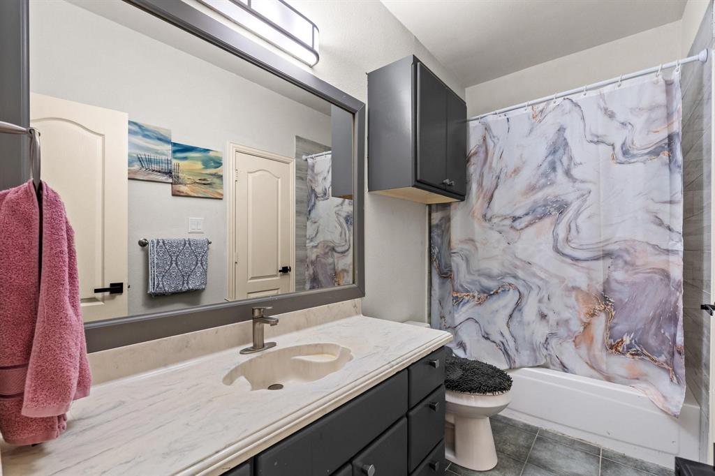 200 Mill Crossing West Colleyville, TX 76034 - Photo 25 of 40 a bathroom with a sink toilet and shower