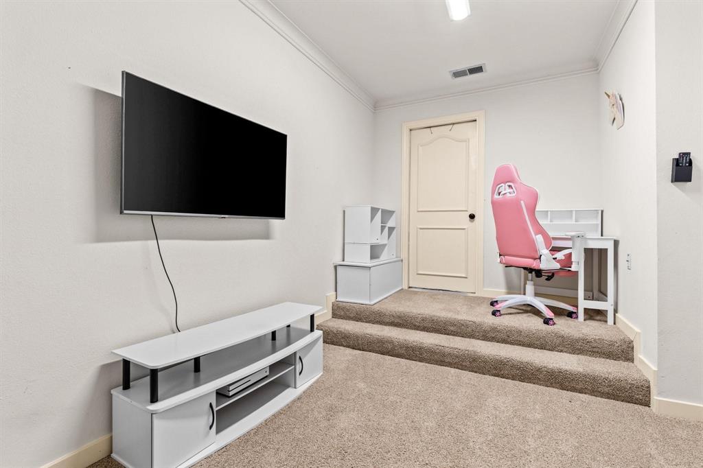 200 Mill Crossing West Colleyville, TX 76034 - Photo 26 of 40 a living room with furniture and a flat screen tv