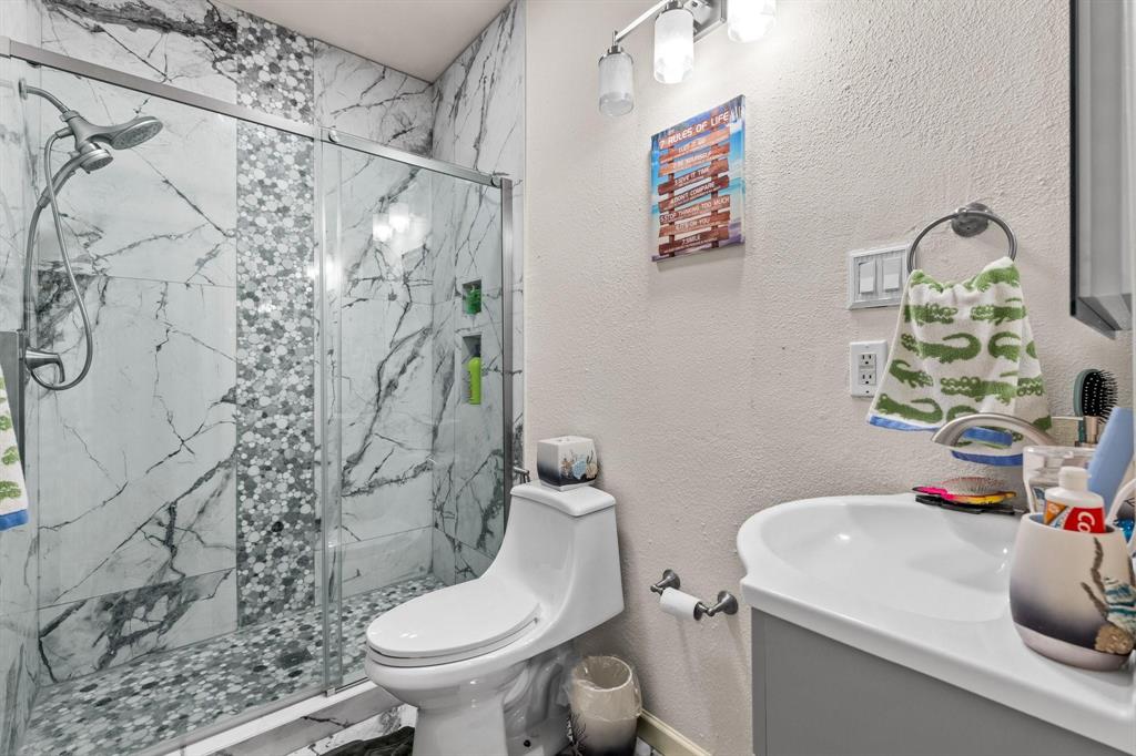 200 Mill Crossing West Colleyville, TX 76034 - Photo 28 of 40 a bathroom with a sink toilet and shower