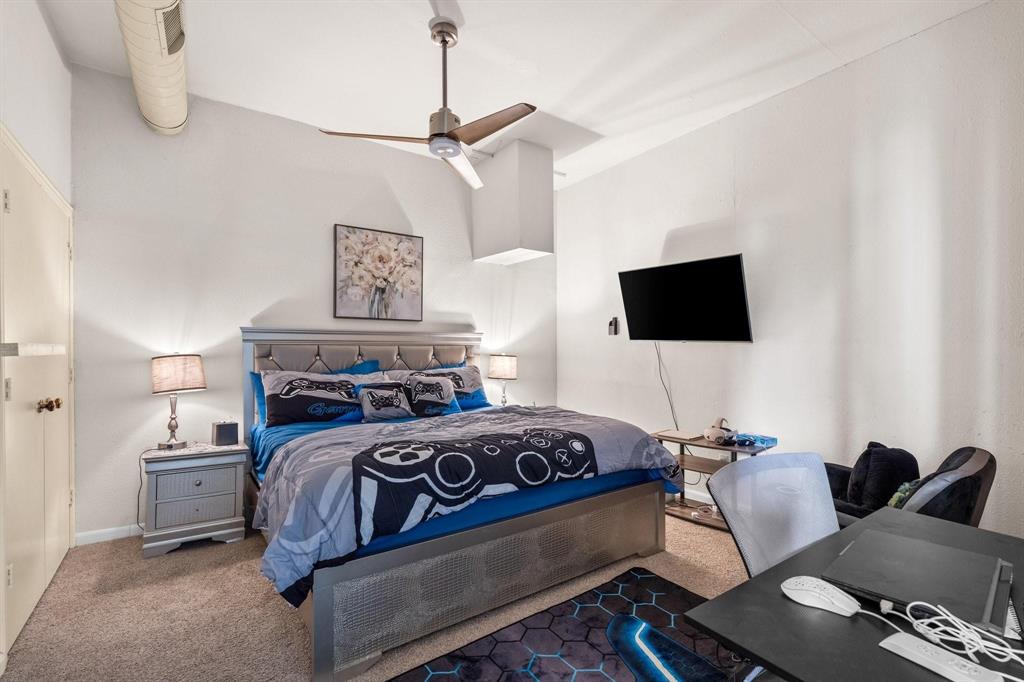 200 Mill Crossing West Colleyville, TX 76034 - Photo 32 of 40 a bedroom with a bed and a flat screen tv