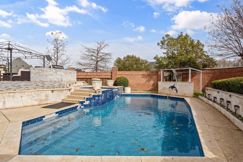 200 Mill Crossing West Colleyville, TX 76034 - Photo 33 of 40 a view of a swimming pool with a yard