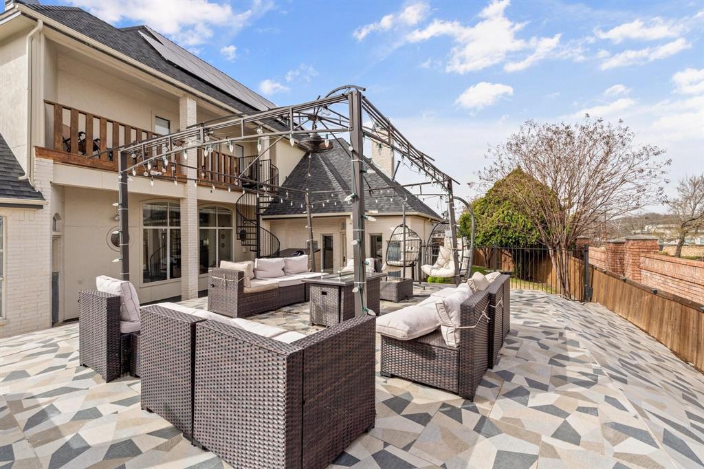 200 Mill Crossing West Colleyville, TX 76034 - Photo 39 of 40 a view of a patio with couches and table and chairs with wooden floor and fence