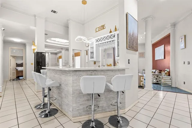 a kitchen with stainless steel appliances kitchen island granite countertop a sink and cabinets