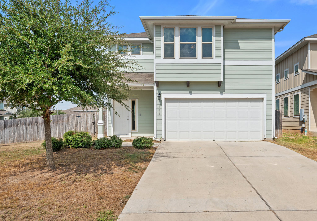 117 Wapiti Road Buda, TX 78610 - Photo 2 of 35 a front view of a house with garden