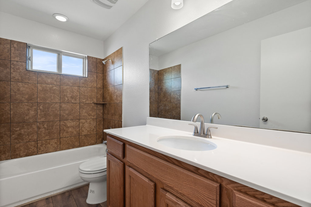 117 Wapiti Road Buda, TX 78610 - Photo 19 of 35 a bathroom with a sink a toilet and shower