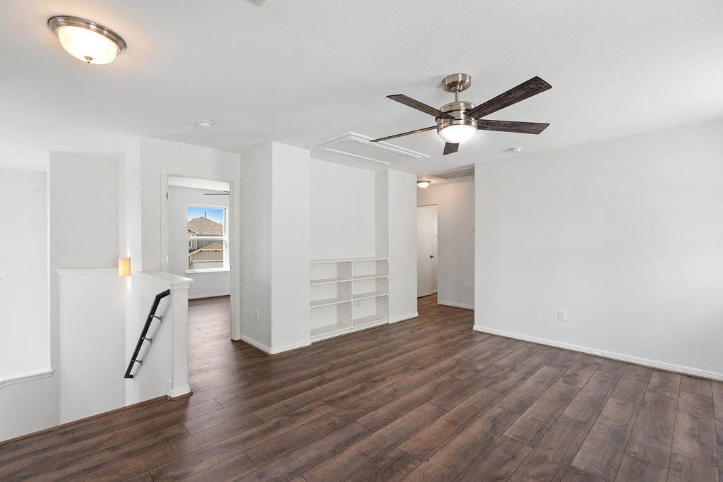 117 Wapiti Road Buda, TX 78610 - Photo 25 of 35 a view of empty room with wooden floor