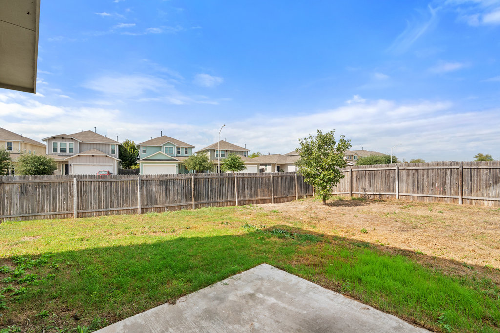117 Wapiti Road Buda, TX 78610 - Photo 26 of 35 a view of a house with a yard and a big yard