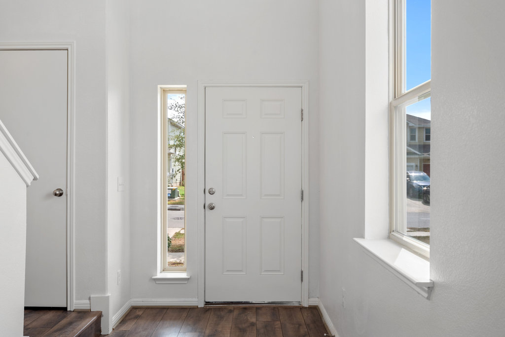 117 Wapiti Road Buda, TX 78610 - Photo 3 of 35 a view of an entryway with wooden floor