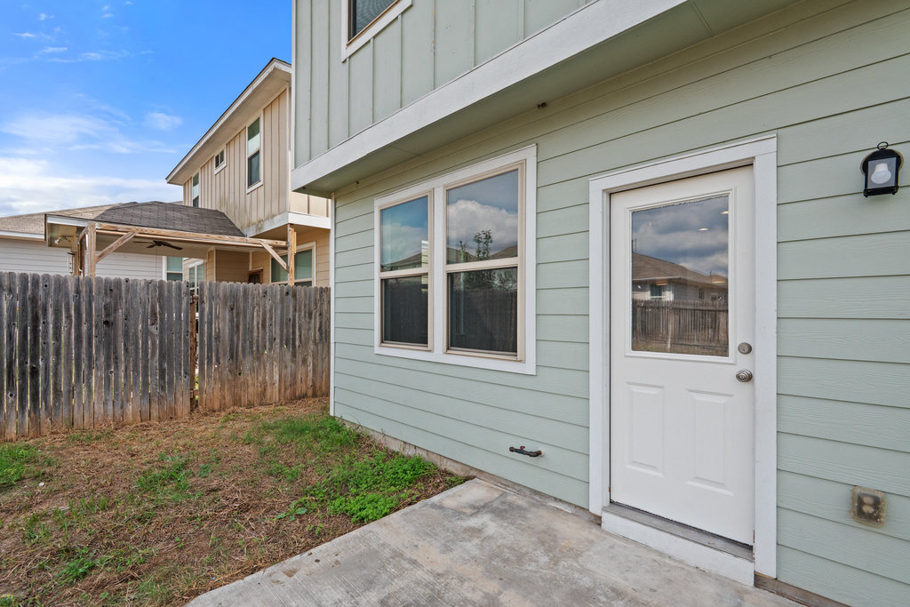 117 Wapiti Road Buda, TX 78610 - Photo 28 of 35 a front view of a house with a yard