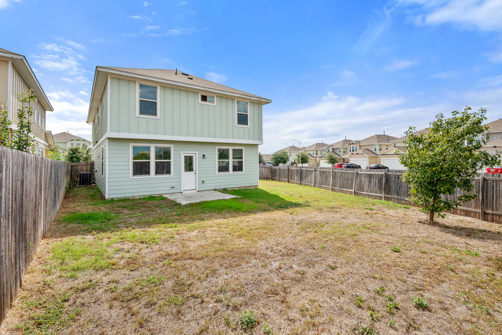 117 Wapiti Road Buda, TX 78610 - Photo 30 of 35 a view of house with backyard and swimming pool