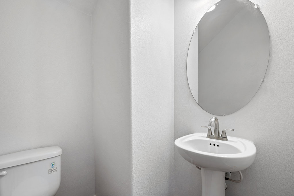 117 Wapiti Road Buda, TX 78610 - Photo 8 of 35 a bathroom with a sink a mirror and toilet