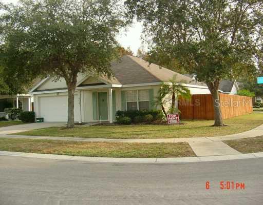 9740 Fredericksburg Road Tampa, FL 33635 - Photo 1 of 1 a front view of a house with a garden