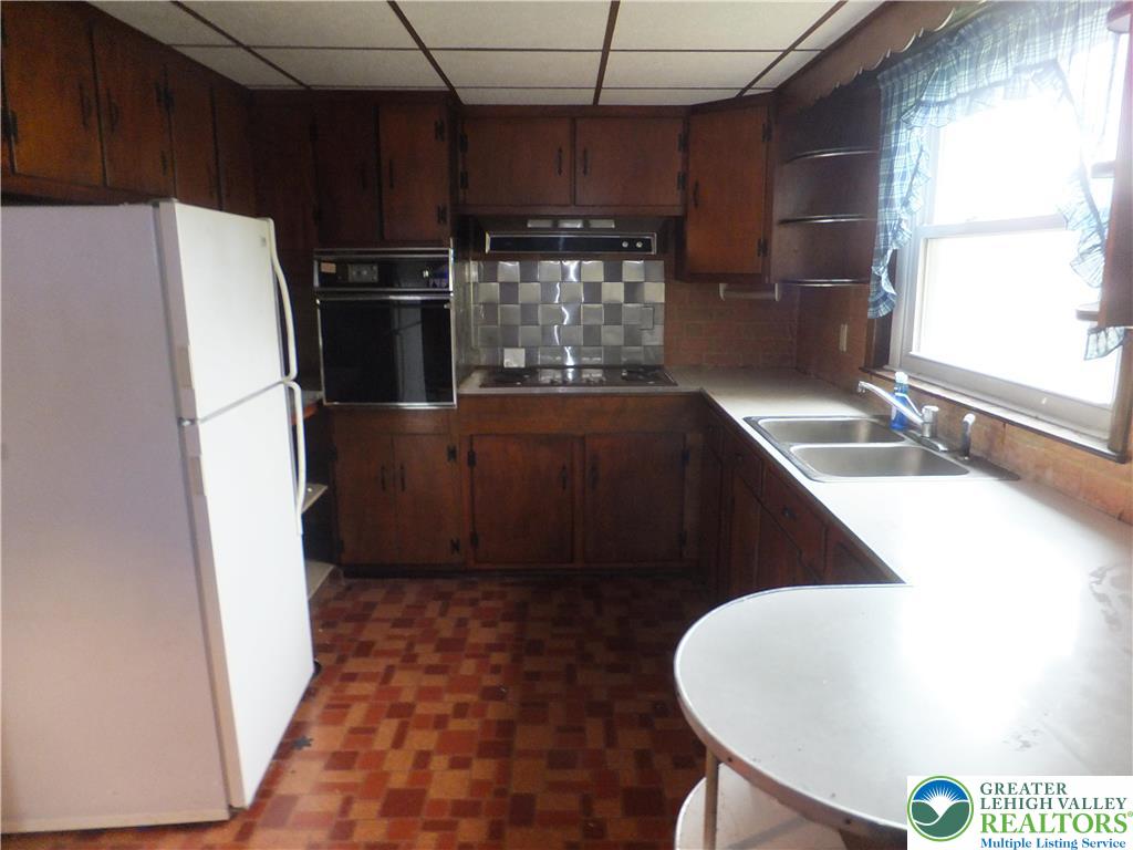 7 North 4th Street Coplay, PA 18037 - Photo 7 of 23 a kitchen with refrigerator and window