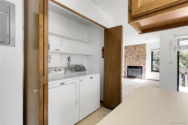 a spacious bedroom with a bed and a tv