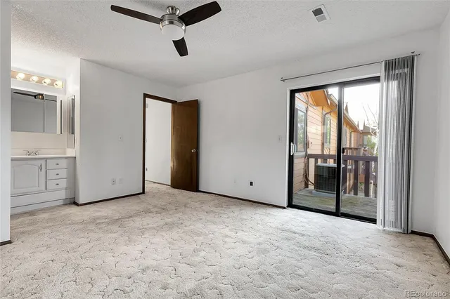 a view of balcony with wooden floor and fence