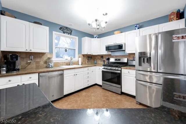 a kitchen with a refrigerator stove and microwave