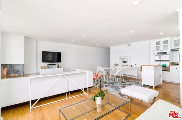 a living room with furniture and flat screen tv