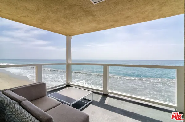 a view of a living room and floor to ceiling window