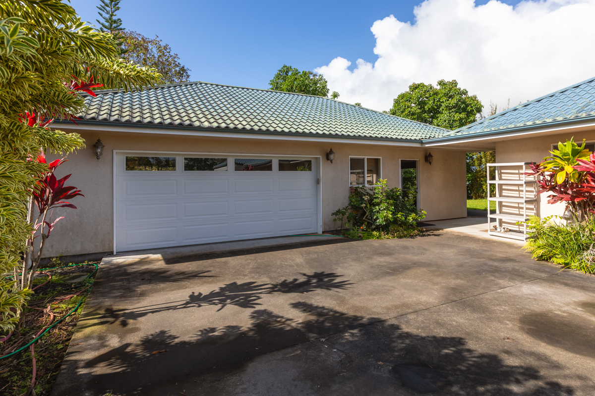 73-4571 Kukuki Street, Unit A Kailua-Kona, HI 96740 - Photo 21 of 30 a front view of a house with a yard