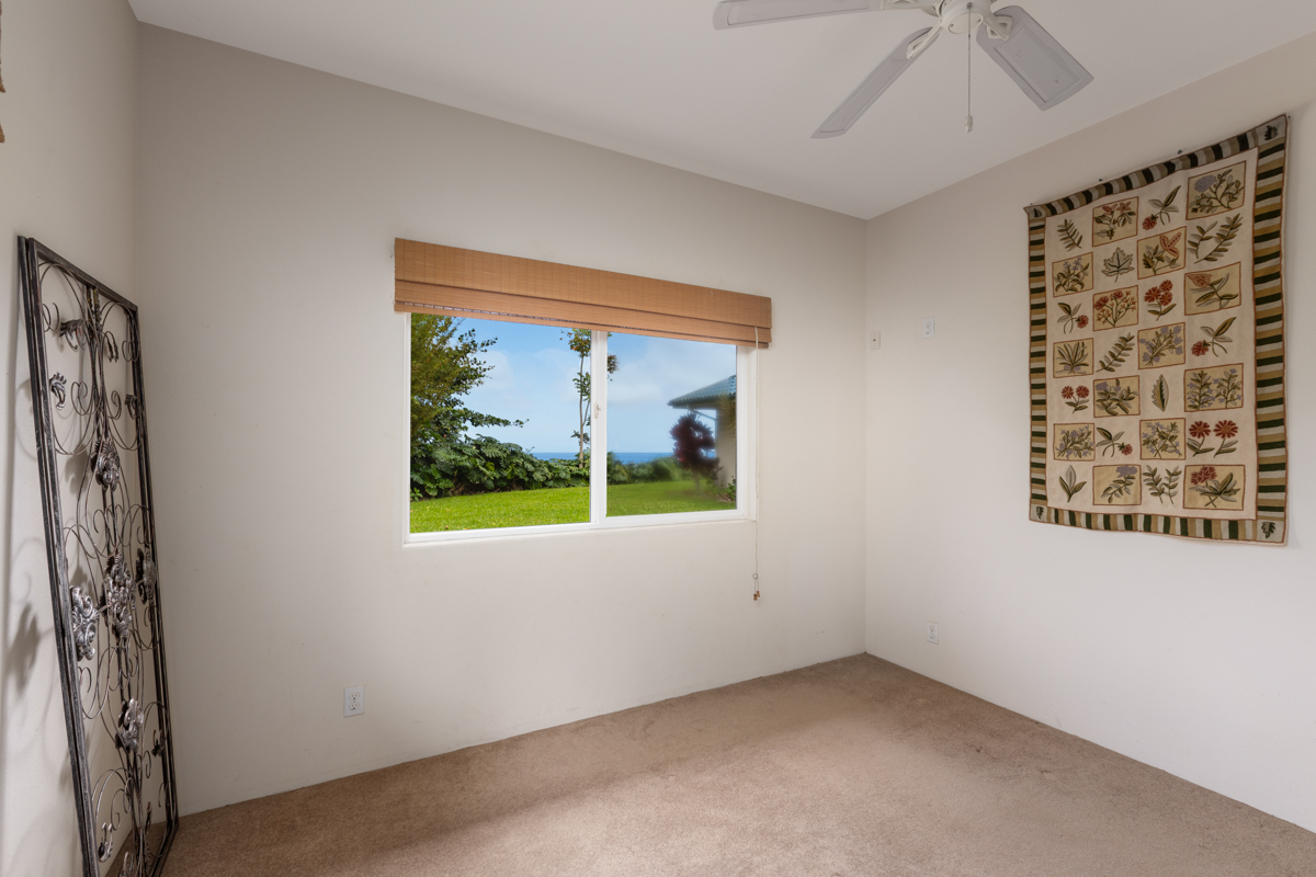 73-4571 Kukuki Street, Unit A Kailua-Kona, HI 96740 - Photo 24 of 30 an empty room with windows