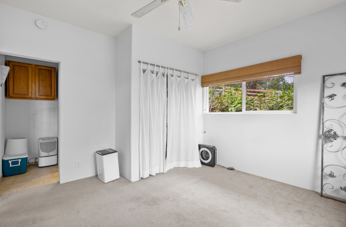 73-4571 Kukuki Street, Unit A Kailua-Kona, HI 96740 - Photo 25 of 30 a view of an empty room with a window