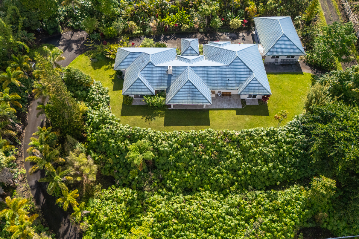 73-4571 Kukuki Street, Unit A Kailua-Kona, HI 96740 - Photo 5 of 30 an aerial view of a house with swimming pool and garden