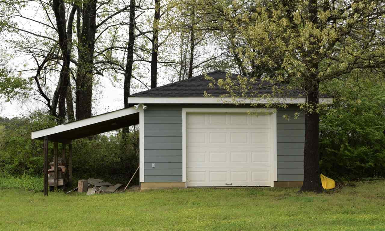 109 Watkins Farm Road Rolesville, NC 27571 - Photo 22 of 23 Extra storage plus covered area for parking lawn mower, etc. Shed