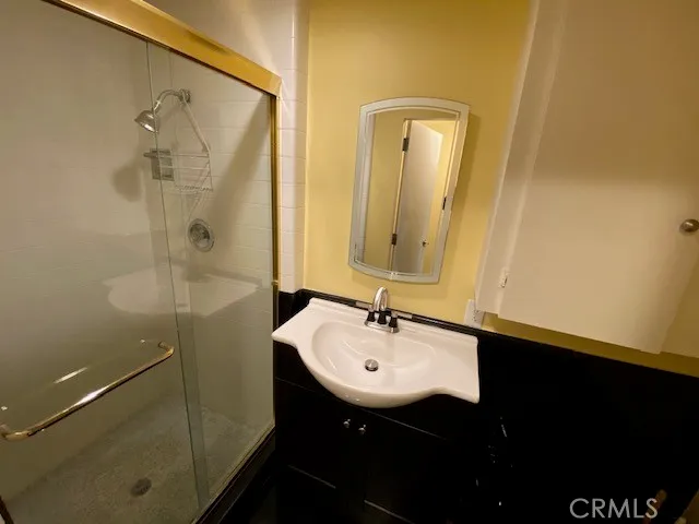 a bathroom with a sink and mirror