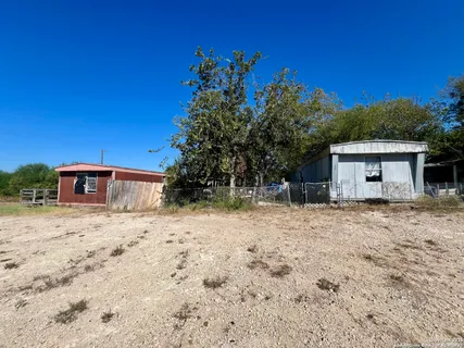 a house with trees in the background