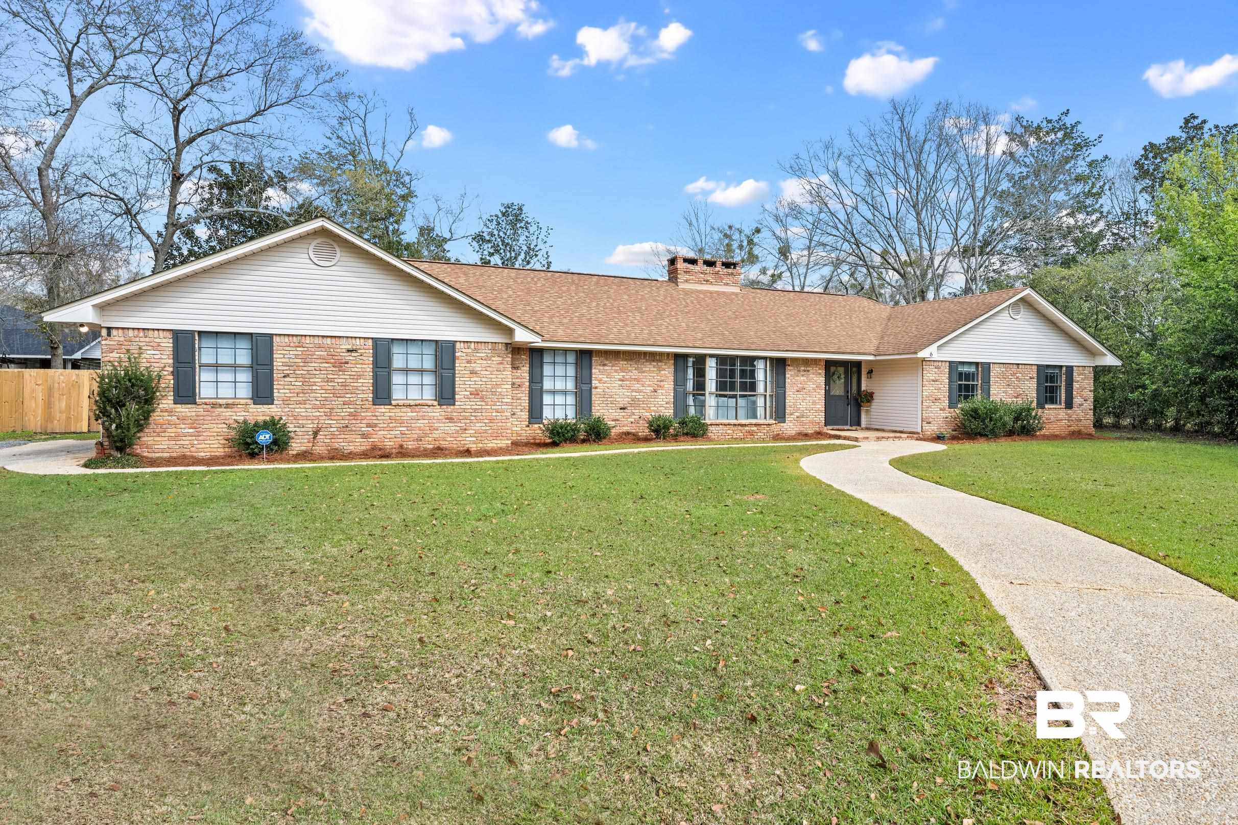 6 Wren Circle Foley, AL 36535 - Photo 3 of 55 Ranch-style home with brick siding, a shingled roof, a front lawn, fence, and a chimney