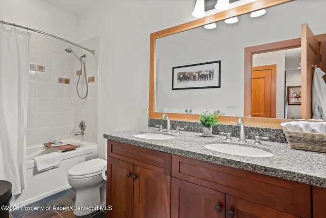 a bedroom with a bed and a table