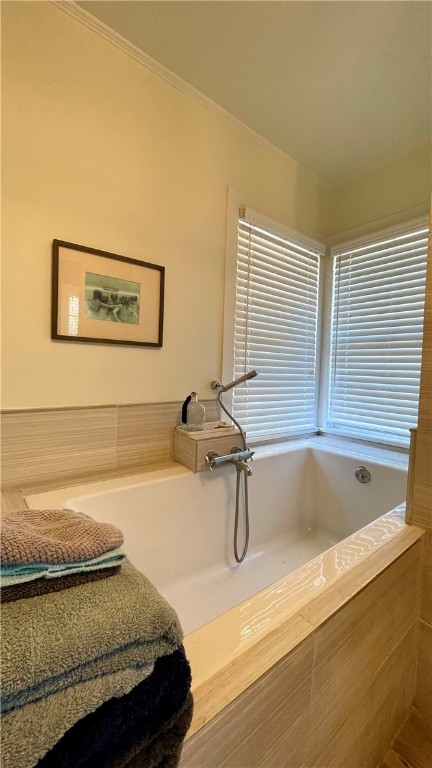 704 Colorado Street Bremond, TX 76629 - Photo 15 of 42 a bathroom with a tub and a window
