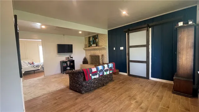 a living room with furniture fireplace and flat screen tv