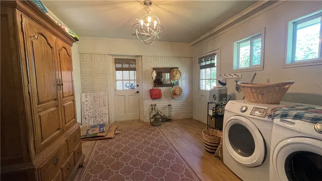 a utility room with closet dryer and washer