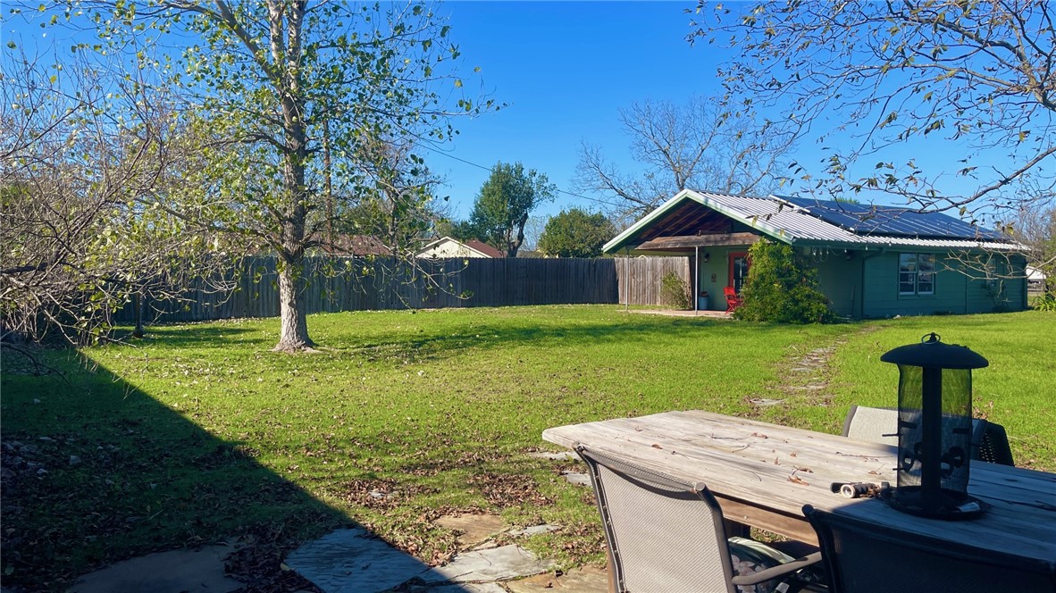 704 Colorado Street Bremond, TX 76629 - Photo 23 of 42 a view of a house with backyard and a tree