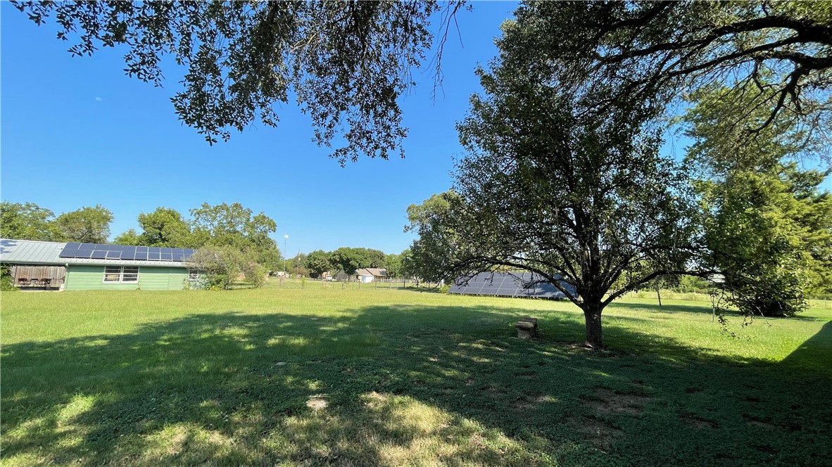 704 Colorado Street Bremond, TX 76629 - Photo 28 of 42 a view of yard with swimming pool and green space