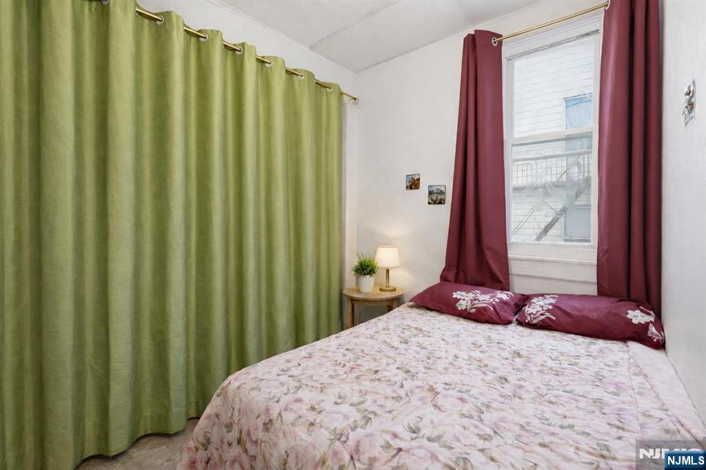 509 Monastery Place Union City, NJ 07087 - Photo 11 of 49 a bedroom with a bed and a window