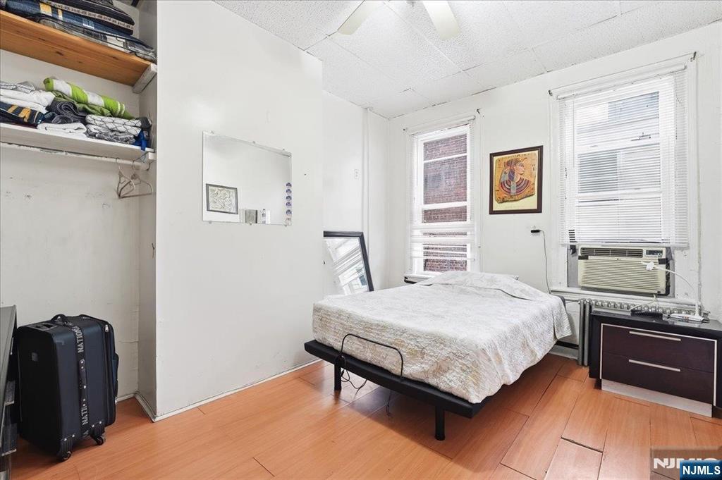 509 Monastery Place Union City, NJ 07087 - Photo 21 of 49 a bedroom with a bed and wooden floor