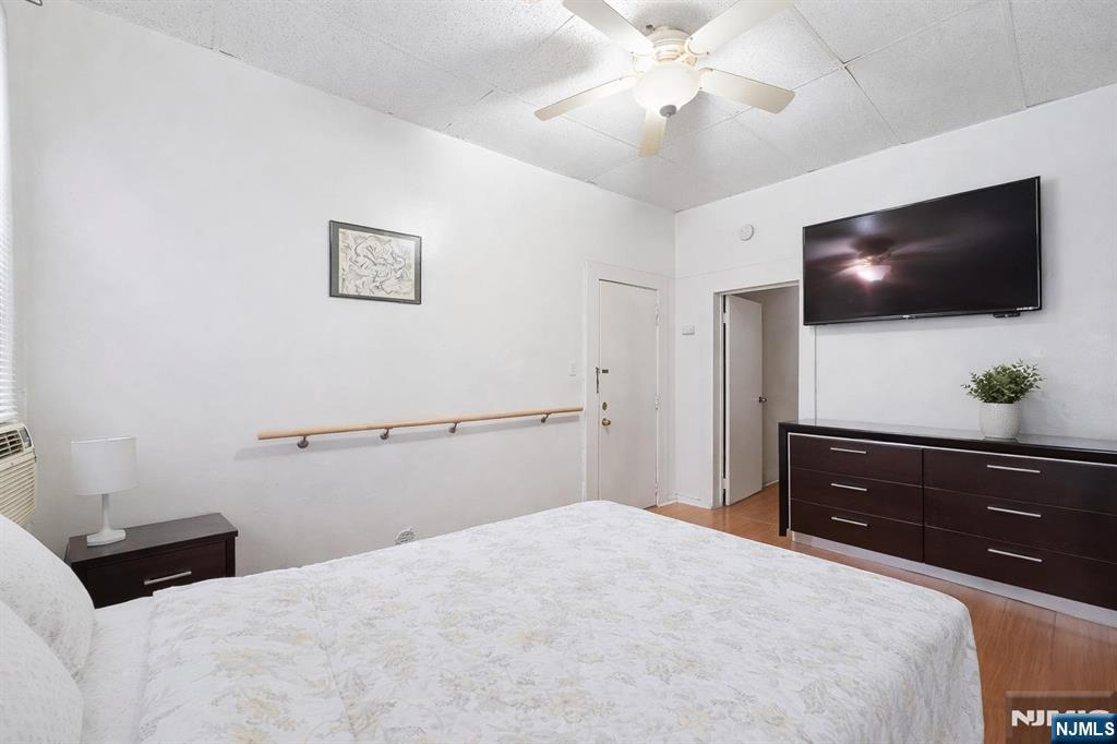 509 Monastery Place Union City, NJ 07087 - Photo 22 of 49 a bedroom with a bed and a flat screen tv