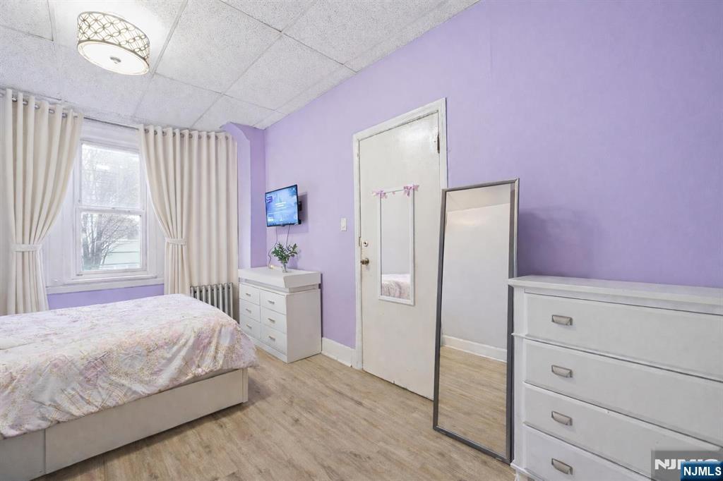 509 Monastery Place Union City, NJ 07087 - Photo 23 of 49 a bedroom with a bed and a dresser