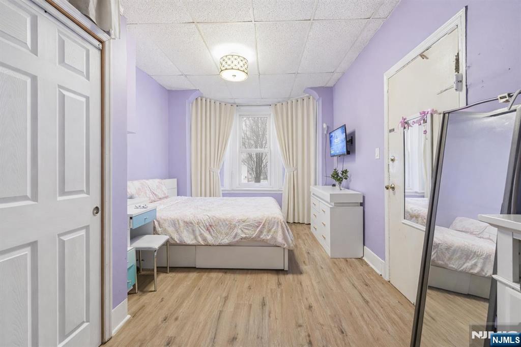 509 Monastery Place Union City, NJ 07087 - Photo 24 of 49 a spacious bedroom with a bed and a window