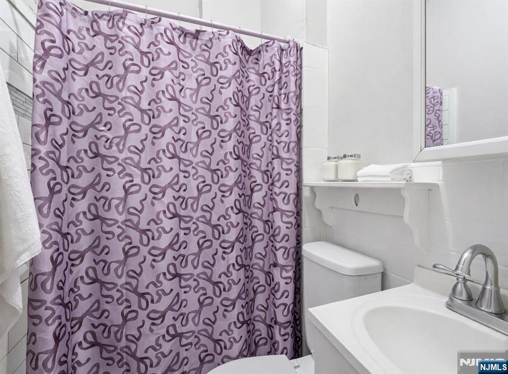 509 Monastery Place Union City, NJ 07087 - Photo 29 of 49 a bathroom with a toilet and a sink